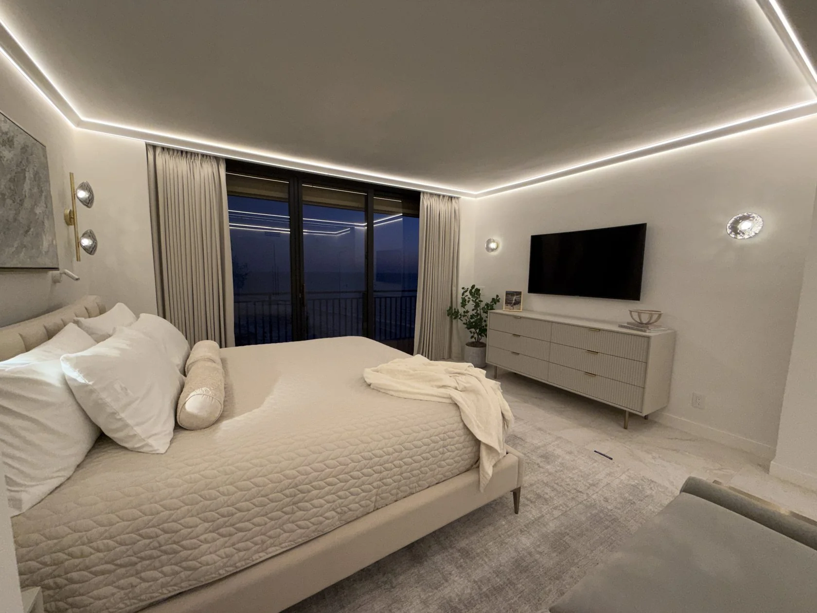 Albedo — master bedroom at dusk with Gulf view