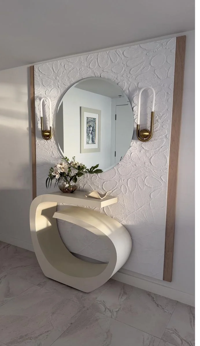Sculptural entry console and round mirror
